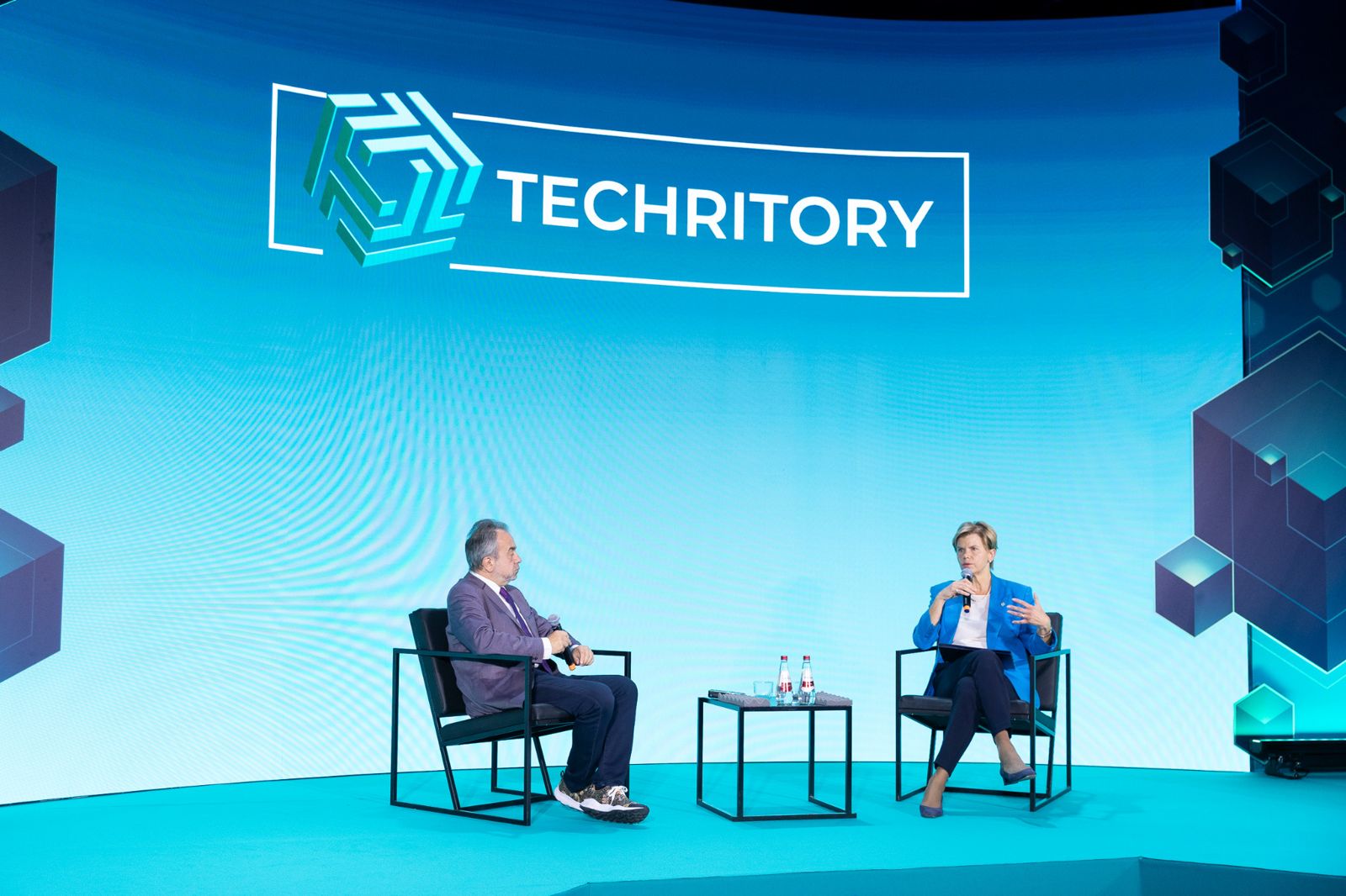 Dean Bubley and Latvian Foreign Minister Baiba Braže seated on stage for a fireside chat at Techritory 2026